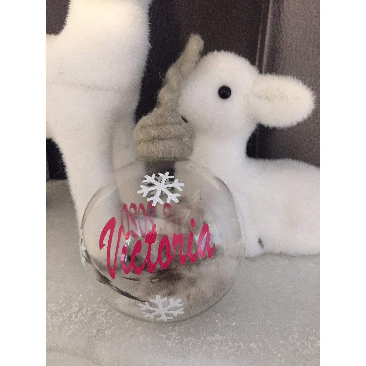 Boule en verre et plumes personnalisée